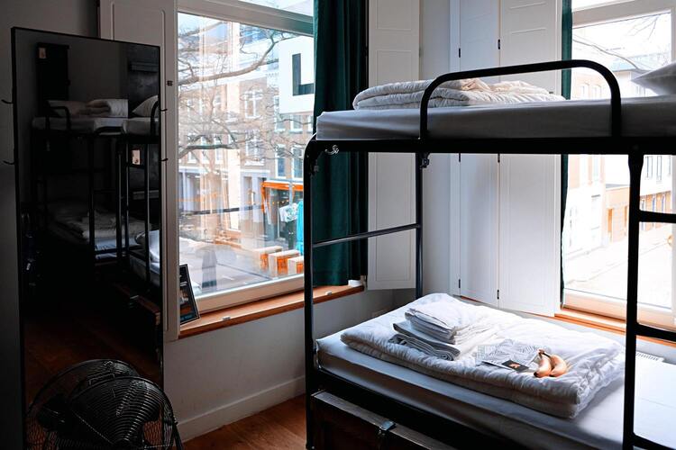 Bunkbeds in hotel room overlooking the city.